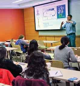 Faculty member lecturing in a science classroom